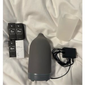 Vitruvi stone diffuser in charcoal with water refill cup and 4 oils